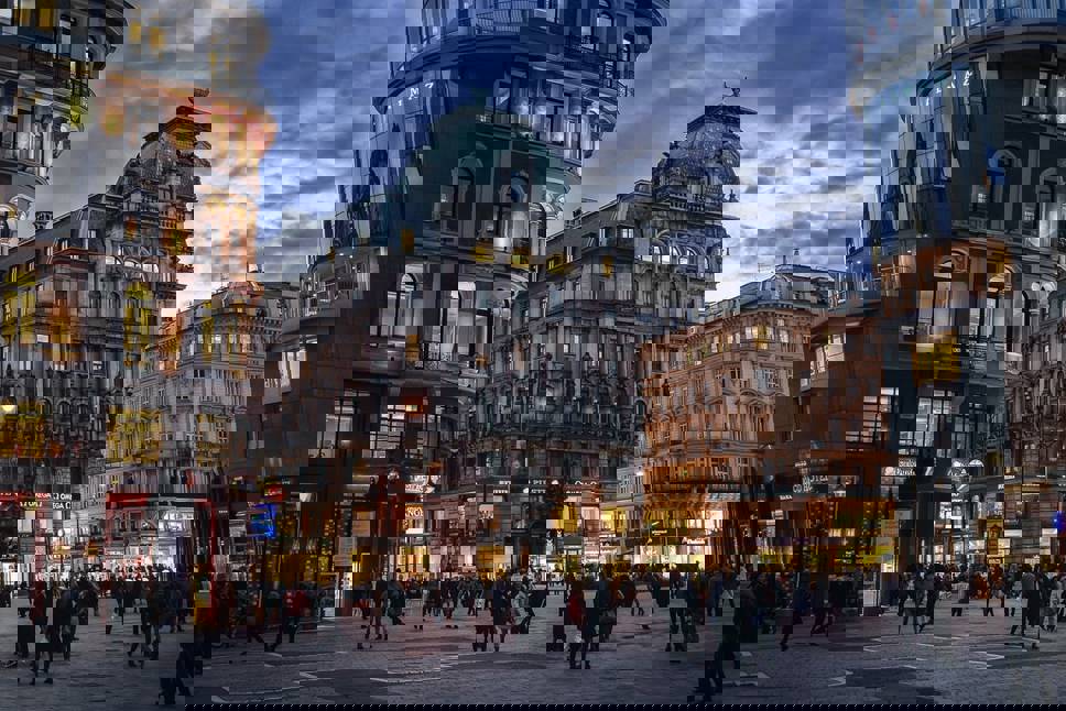 People and buildings in Vienna in the evening