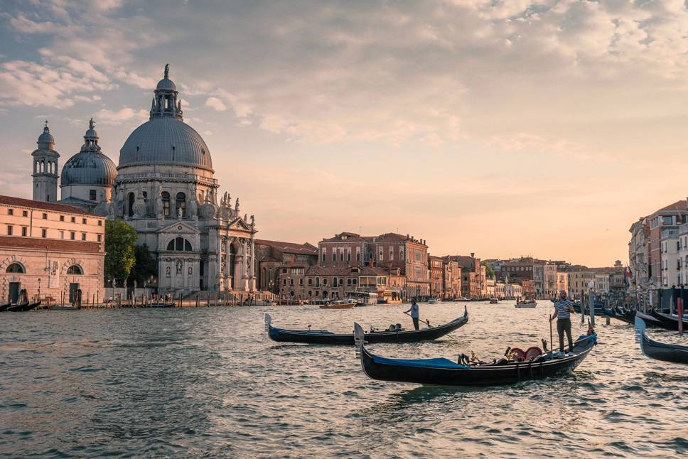 Venice canal with boats and buildings